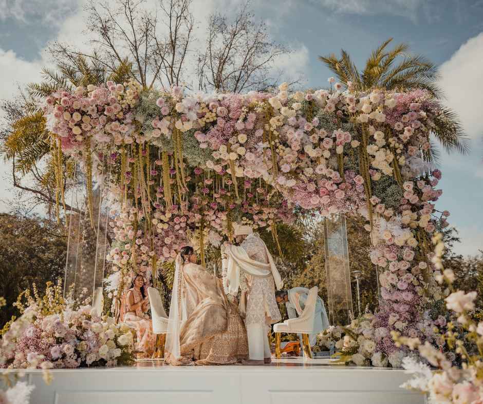 Bride and Groom exchanging wedding garlands on the mandaap