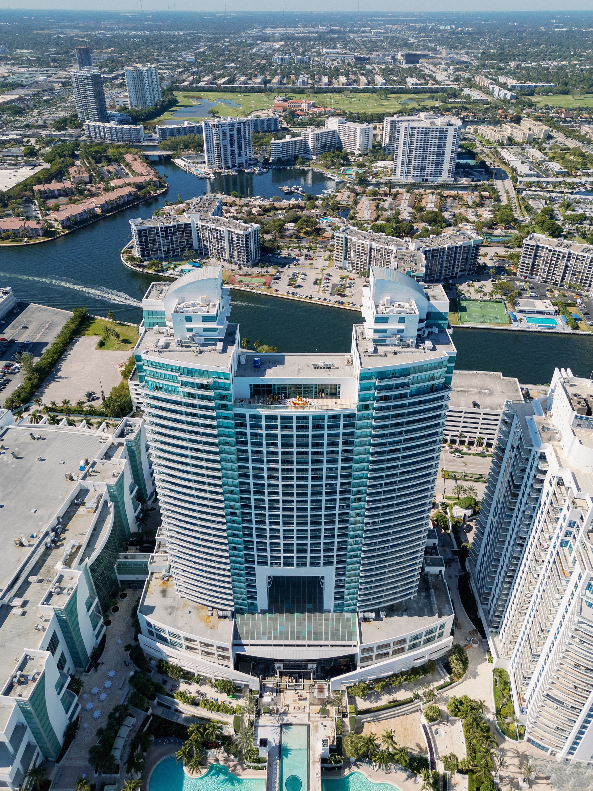 Overhead drone image of the Diplomat Hotel in Hollywood, FL with a Haldi Celebration happening on the rooftop.