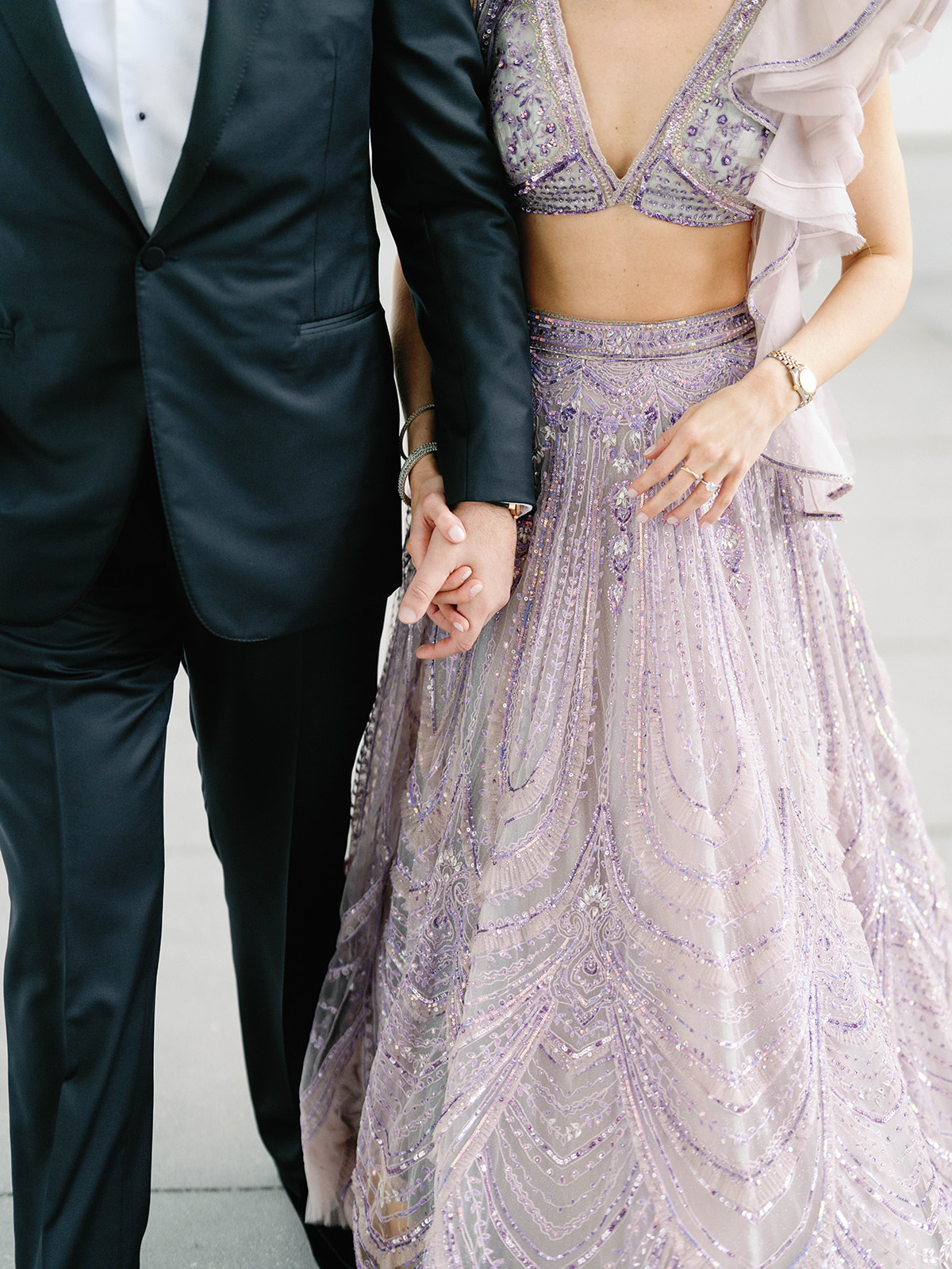 bride and groom holding hands