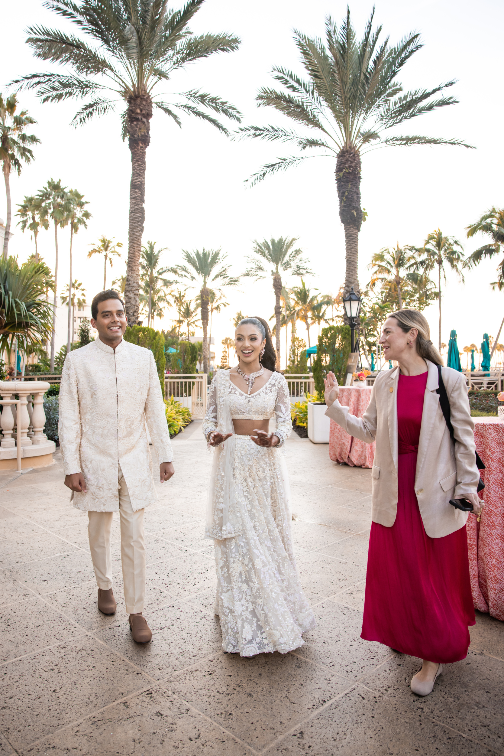 Wedding Planner and couple viewing the event space for the first time with excitement on their faces.